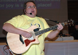 Grace On Demand founder Austin Rahill, the youth ministry coordinator at Mary, Queen of Peace Parish in Danville, leads the music during the Archdiocesan Youth Rally Mass on March 5 at Cathedral High School in Indianapolis. Grace On Demand band members and St. Vincent de Paul Parish youth ministry coordinator Dave Gehrich of Shelbyville recently started an &ldquo;Ador-Rally&rdquo; youth ministry program that will bring eucharistic adoration to teenagers and young adults at archdiocesan parishes.