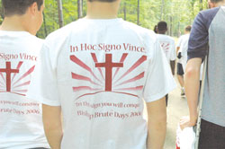 T-shirts worn by participants at Bishop Brut&eacute; Days in June show the message that guides people of faith: &ldquo;In this sign, you will conquer.&rdquo; The annual retreat helps teenage boys grow in their faith and be open to a possible call to the priesthood. (Photo by Sean Gallagher) 