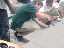 Earlier this year, Cathedral High School students Patrick McNulty and Mac Banks helped chisel and carve a Celtic cross in honor of Stephen McNulty, Patrick&rsquo;s brother, who died in March from heart problems. The cross, which was recently completed and dedicated at the private Catholic high school in Indianapolis, now stands as a tribute to Stephen on the Cathedral campus. (Photo by John Shaughnessy) 