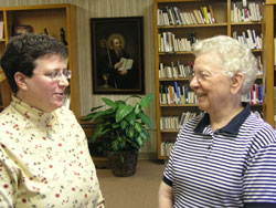 Benedictine Sisters Julie Sewell, left, and Mildred Wannemuehler chat at Our Lady of Grace Monastery, their religious community&rsquo;s home in Beech Grove.  