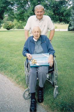 Father John Mannion and Charlie Ressler celebrate Father&rsquo;s Day in 2006. (Submitted photo) 