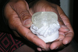 This ceramic creation of two small hands cupped together holding a glass heart is one of LaTonya Turner&rsquo;s most treasured possessions. 