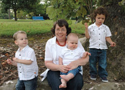 Holy Spirit parishioner Diana Hay of Indianapolis poses for an informal portrait with her active grandsons, from left, Aaron Baker, Daniel Baker and Dylan Mercado, at Ellenberger Park in Indianapolis. Hay plans to visit her daughters, Julie Mercado and Kimberly Baker, and her grandchildren in Dayton, Ohio, this weekend to celebrate Mother&rsquo;s Day.