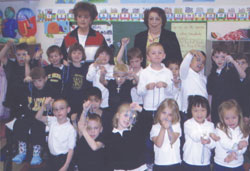Standing at back, from left, rosary ladies Mary Anne Grande and Wilma Cook pose for a photo with Linnea Green&rsquo;s kindergarten class at St. Michael School in Greenfield. (Submitted photo) 