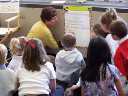 Cassandra Ray, career teacher at St. Philip Neri School in Indianapolis, works with students. &ldquo;As a first-year teacher, the TAP [Teacher Advancement Program] observations and rubric helped me see what I was doing well, and helped me focus on things that I needed to improve,&rdquo; she said. (Submitted photo) 