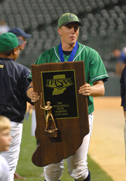 Senior Mark Branigan clutches the ISHAA Class 4A state championship trophy after Cathedral High School beat Kokomo 7-2 on June 16. Mark is the son of Roger and Barbara Branigan, who are members of St. Pius X Parish in Indianapolis. (Submitted photo by Doug McSchooler)