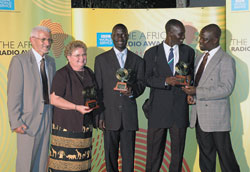 Comboni Father Tonino Pasolini, left, station director of Radio Pacis in Arua, Uganda, accepts the British Broadcasting Corporation&rsquo;s award for &ldquo;Best New Radio Station in Africa&rdquo; with Indianapolis native Sherry Meyer, station manager; assistant news editor Dranibo Felix; assistant program manager Driliga George; and program manager Anecho Sam on May 26 in Nairobi, Kenya. The BBC said &ldquo;Radio Pacis is a fine example of what a community radio station based outside the capital can do.&rdquo; (Submitted photo) 