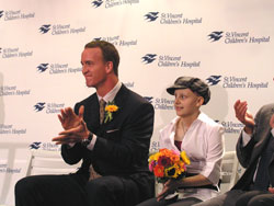 Indianapolis Colts quarterback Peyton Manning sits with 14-year-old Sydney Taylor of Brownsburg. Sydney introduced the Colts quarterback at a Sept. 5 press conference where it was announced that St.&nbsp;Vincent Children&rsquo;s Hospital in Indianapolis would be renamed Peyton Manning Children&rsquo;s Hospital at St. Vincent.