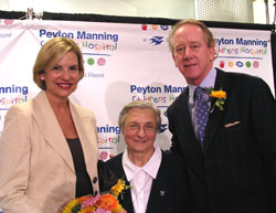 Daughter of Charity Mary John Tintea, center, poses with Peyton Manning&rsquo;s parents, Olivia and Archie, at a Sept. 5 press conference announcing the renaming of St.&nbsp;Vincent Children&rsquo;s Hospital for the Indianapolis Colts&rsquo; quarterback.
