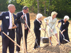 Numerous dignitaries share ground&shy;breaking duties for The Villas at Gu&eacute;rin Woods on Sept. 18. From left are Stephen Smith, director of the Division on Aging of the Indiana Family and Social Services Administration; New Albany Mayor James Garner; Georgetown resident Scyble Payne; Lt. Gov. Becky Skillman; and Providence Sister Barbara Ann Zeller, president of Gu&eacute;rin Inc. (Photo by Patricia Happel Cornwell) 	