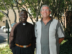 Sudanese Father Alfred Loro Caesar, left, and Comboni Father Michael Barton pose for a photograph on Aug. 7 outside the Archbishop O&rsquo;Meara Catholic Center in Indianapolis.	