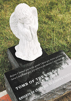 This memorial for babies who have died is located near the south drive of Our Lady of Peace Cemetery at 9001 N. Haverstick Road in Indianapolis. The St. Joseph&rsquo;s Council of the Knights of Columbus in Indianapolis raised funds for the memorial on cemetery land donated by the Archdiocese of Indianapolis. The Scripture passage from the Book of Jeremiah reads, &ldquo;Before I formed you in the womb I knew you, before you were born I dedicated you, a prophet to the nations I appointed you&rdquo; (Jer 1:5).