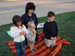 St. Luke parishioner Ann Green and her children, Mary, John Paul and Jimmy, of Indianapolis, pray outside the Planned Parenthood clinic, the largest abortion facility in the state, on Oct.&nbsp;2 during the first &ldquo;40 Days for Life&rdquo; prayer campaign in the archdiocese.
