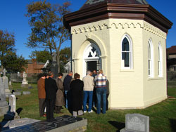 Madison-area Catholics stand outside the recently restored St. Patrick Cemetery chapel during the &shy;rededication ceremony and All Souls Day Mass on Nov. 2. The original crucifix, which is being restored in Cleveland, was donated to the parish by Mary Prenatt in the early 1900s. 