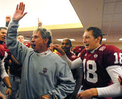 Indiana University head football coach Bill Lynch leads the celebration in the Hoosiers&rsquo; locker room after IU&rsquo;s last-minute win over Purdue University on Nov. 17. The win capped an emotional season for the team, which was rocked earlier in the year by the death of its previous coach, Terry Hoeppner. (Photo by Paul Riley, IU Athletics)