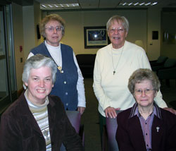 Four members of the Sisters of the Third Order of St. Francis who are parish life coordinators in the archdiocese pose for a photo at their congregation&rsquo;s motherhouse in Oldenburg. Sister Margie Niemer, front row, left, leads St. Peter Parish in Franklin County. Sister Shirley Gerth, front row, right, leads St.&nbsp;Anne Parish in New Castle and St. Rose Parish in Knightstown. Sister Christine Ernstes, back row, left, leads Immaculate Conception Parish in Millhousen and St. Denis Parish in Jennings County. Sister Patty Campbell, back row, right, leads St. Mary-of-the-Rock Parish in Franklin County. (Submitted photo) 