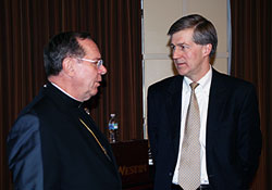 Archbishop Daniel M. Buechlein shares a moment with University of Notre Dame Law School Professor Matthew J. Barrett. Barrett was the keynote speaker at the Indiana Catholic Conference&rsquo;s annual legislator luncheon on Jan. 16. (Photo by Charles Schisla) 