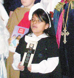St. Joan of Arc School second-grader Mercedes Bickel portrays St. Theodora Gu&eacute;rin for the All Saints Day Mass on&nbsp;Nov. 1 at the Indianapolis North&nbsp;Deanery grade school. Students study the life of the foundress of the Sisters of Providence of Saint&nbsp;Mary-of-the-Woods. (Submitted photo) 