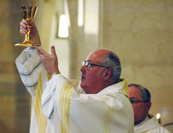 Msgr. Joseph F. Schaedel, vicar&nbsp;general, elevates the Blood of Christ as he celebrates Mass on May 20, 2007, at Holy&nbsp;Name of Jesus Church in Beech&nbsp;Grove on the occasion of his 25th&nbsp;anniversary of ordination to the priesthood. He is the keynote speaker for the fourth annual Catholic Pro-Life Dinner on March 8 in Indianapolis. (File photo by Mary Ann Wyand)	