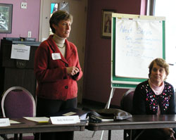 Holly McKiernan, senior vice president and chief counsel for Lumina Foundation and a member of the Catholic Community Foundation board of trustees, left, leads the facilitation process for the archdiocese&rsquo;s strategic planning meeting held on Feb.&nbsp;14 at Our Lady of Fatima Retreat House in Indianapolis. Connie Zittnan, director of Mother Theodore Catholic Academies, listens to her presentation. (Photo by Mike Krokos) 