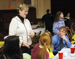 Annette &ldquo;Mickey&rdquo; Lentz talks with students at the annual A Promise to Keep: God&rsquo;s Gift of Human Sexuality awards luncheon on March 6 at the Archbishop&nbsp;O&rsquo;Meara Catholic Center in Indianapolis. The archdiocesan volunteer peer mentor chastity program is in its 14th year. (Photo by Mary Ann Wyand) 