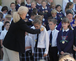 Christine Cohn, U.S. Department of Education official, celebrates with St.&nbsp;Christopher students in Indianapolis after their school was named a Blue Ribbon School of Excellence. (File photo by Brandon A. Evans)