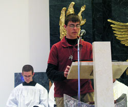 Peter Jansen serves as&nbsp;a lector at the archdiocesan youth Mass held on April 20 at the National Shrine of Our Lady of Czestochowa in Doylestown, Pa. Also pictured is altar server Michael Kubancsek. Both teenagers are members of Our Lady of the Greenwood Parish in Greenwood and are considering vocations to the priesthood. (Photo by Bryce Bennett) 