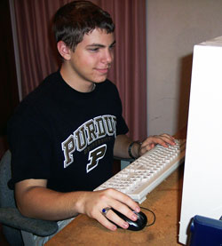 Ben Doll, a member of St. Anthony of Padua Parish in Morris, spent plenty of time at his computer to produce a DVD marking the parish&rsquo;s 150th anniversary. (Submitted photo) 