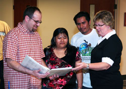 During an adult faith formation event on April 24 at St. Bartholomew Parish in Columbus, Kathy Davis-Shanks, right, a pastoral associate at the parish, speaks with, from left, Greg Andrews, who was received into the full communion of the Church at the parish at the Easter Vigil; Isabel Hernandez, a member of the parish; and her husband, Enrique Hernandez, who was also received into the full&nbsp;communion of the Church during the Easter Vigil. (Submitted photo)