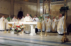 Archbishop Daniel M. Buechlein celebrates Mass on May 2 at St. John the Evangelist Church in downtown Indianapolis for members of the &ldquo;Run for Vocations&rdquo; team that participated in the One America 500 Festival Mini-Marathon on May 3. (Photo by Sean Gallagher)