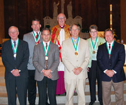 St. John Bosco Award recipients from Indianapolis pose for a photograph with Msgr. Joseph F. Schaedel, vicar general, after the Catholic Youth Organization Awards ceremony on May 8 at SS. Peter and Paul Cathedral in Indianapolis. They are, from left, St. Lawrence parishioner Tom O&rsquo;Brien, St. Matthew parishioner John Sahm, St. Luke the Evangelist parishioner Dan Wagner, St. Joan of Arc parishioner Dr. Charles Hasbrook, Our Lady of Lourdes parishioner Colleen Kenney and St. Pius X parishioner Rob Doyle. St.&nbsp;Malachy parishioner Lori McFarland of Brownsburg was not able to attend the awards ceremony. (Submitted photo/courtesy CYO)