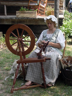 Kelly&nbsp;Kuchenbrod of Evansville, Ind., a volunteer at O&rsquo;Bannon Woods State Park, demonstrates how wool yarn is created with a traditional spinning wheel. (Photo by Patricia Happel Cornwell)