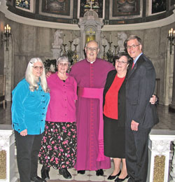 Standing with Msgr. Joseph F. Schaedel, vicar general, in Blessed Sacrament Chapel of SS. Peter and Paul Cathedral in Indianapolis on May 15 are the most recent to complete the archdiocese&rsquo;s Ecclesial Lay Ministry formation program. Pictured, from left, Cathy Louden, Maureen Shea, Msgr. Schaedel, Ann Northam and Ed Isakson. (Photo by Mike Krokos)