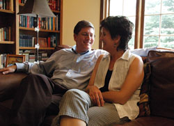 Deacon candidate Ron Reimer laughs with his wife, Susie, at their home in Greenwood. They are members of SS.&nbsp;Francis and Clare of Assisi Parish in Greenwood. (Photo by Sean Gallagher)	