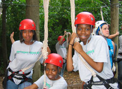 Providence Cristo Rey High School students, left, Breonna Jones, Samoya Heard and Simone Heard prepare for the high-ropes course at Butler University in Indianapolis. The fitness course was part of team-building training for Providence Cristo Rey&rsquo;s corporate work-study program. (Submitted photo) 