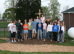 Members of St. Vincent de Paul Parish&rsquo;s youth group provided much of the labor for the installation of the parish&rsquo;s new Stations of the Cross path. Chris Haunert, left, coordinated the service project. (Photos by Melinda Haunert) 