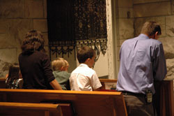 Natural Family Planning teachers Ann and Mike Green, members of St. Alphonsus Parish in Zionsville, Ind., in the Lafayette&nbsp;Diocese, kneel in prayer with their children, Mary, John Paul and Jimmy, during the Mass for chastity on July 25 in the chapel of St. Luke the Evangelist Church in Indianapolis. The liturgy was sponsored by the Archdiocese of Indianapolis, Diocese of Lafayette and Couple to Couple League of Greater Indianapolis. (Photo by Mary Ann Wyand) 