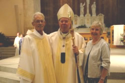 Deacon Ronald Stier and his wife, Donna, pose with Archbishop Daniel M. Buechlein on June 28 in SS. Peter and Paul Cathedral in Indianapolis on the day of Deacon Stier&rsquo;s ordination as a member of the first class of permanent deacons in the history of the Archdiocese of Indianapolis. Deacon Stier ministered at the Richmond Catholic Community parishes of Holy Family, St. Andrew and St. Mary, and at the Wayne County Jail. (Photo by Mary Ann Wyand) 
