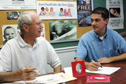 New Right to Life of Indianapolis president Marc Tuttle, right, talks with longtime pro-life volunteer John&nbsp;Hanagan, a member of St. Luke the Evangelist Parish in Indianapolis, during a recent meeting about the upcoming &ldquo;Celebrate Life&rdquo; dinner on Sept. 16 at the Indiana Convention Center in Indianapolis. (Photo by Mary Ann Wyand) 