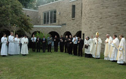 Archbishop Daniel M. Buechlein imparts a blessing on Sept. 8 at the end of the dedication of the new home of Bishop Simon Brut&eacute; College Seminary, 2500 Cold Spring Road, in Indianapolis. (Photo by Sean Gallagher) 