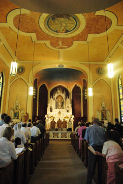 Some 200 worshippers pray during a solemn high traditional Latin Mass celebrated on Sept. 5 at SS.&nbsp;Philomena and Cecilia Church in Oak Forest in the Batesville Deanery to celebrate the completion of the restoration of much of the church&rsquo;s interior decoration. (Photo by Sean Gallagher) 