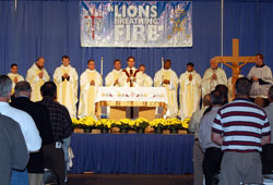 Congregation of Marians of the Immaculate Conception Father Donald Calloway presides during Mass at the third annual Indiana Catholic Men&rsquo;s Conference on Sept. 27. Eleven priests concelebrated the liturgy. Besides the slate of speakers and Mass, the daylong event included the opportunity for the sacrament of reconciliation as well as exposition of the Blessed Sacrament and Benediction. More than 30 priests heard more than 500 confessions throughout the day. At one point, 18 priests were hearing confessions, conference organizer Mike Fox said. (Photo by Mike Krokos) 