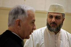 Bishop Dale J. Melczek of Gary, Ind., and Imam Mongy El Quesny of the Northwest Indiana Islamic Center chat on Oct. 26 at the center in Crown Point during the opening session of the 2008&nbsp;Midwest Muslim-Catholic Dialogue. This was the first time that the Diocese of Gary hosted the interreligious dialogue. (Photo by Tim Hunt,)