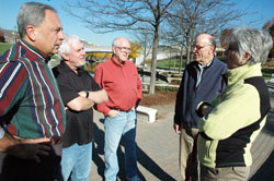 Father John Mark Ettensohn, left, Brother Pat McGee and Brother Paul Daly, all members of the Missionary Oblates of Mary Immaculate, chat on Nov.&nbsp;5 along the Canal Walk in downtown Indianapolis with Fred and Tana Moses, who live along the canal. In what they call &ldquo;Mission with Secularity,&rdquo; the Oblates seek to reach out through ordinary conversations and relationships to those who have a secularist worldview and feel no need for God. (Photo by Sean Gallagher) 