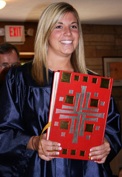 Abigail Lilly, a 2008&nbsp;graduate of Our Lady of Providence Jr./Sr. High School in Clarksville, carries the Lectionary to begin the processional for her senior class baccalaureate ceremony, which was held in May at Our Lady of Perpetual Help Church in New Albany. (Submitted photo) 