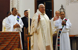 Father Arturo Miguel Ocampo, pastor of St. Patrick Parish in Indianapolis, was the principal celebrant for the fifth annual archdiocesan celebration of the feast of St.&nbsp;Martin de Porres on Nov. 3 at St. Patrick Church in Indianapolis. Concelebrants from Indianapolis parishes were Father Kenneth Taylor, pastor of Holy Angels Parish; Father&nbsp;Steven Schwab, pastor of St. Thomas Aquinas Parish; and Franciscan Father&nbsp;Thomas Fox, Hispanic ministry assistant for the archdiocese, who is in residence at Sacred Heart of Jesus Parish. Deacon Emilio Ferrer-Soto, left, and Deacon&nbsp;Oscar Morales, right, assisted with the multicultural liturgy. Rev. Samuel Ruiz, a Lutheran minister standing behind Father Ocampo, was a special guest at the liturgy. (Photo by Mary Ann Wyand) 