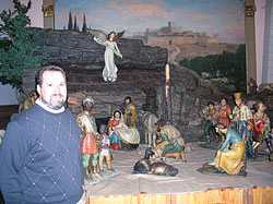 For Phil Schouten, the recently restored Nativity scene at SS. Peter and Paul Cathedral in Indianapolis brings back fond memories of his father, John, an immigrant who came to the United States through the help of the Church, an immigrant who volunteered to set up the cr&egrave;che each Christmas as a way of giving thanks for the Church&rsquo;s help to his family. (Photo by John Shaughnessy) 