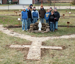 Chris Sosnowski, standing in the back row at the left with a hat and hood on his head, said the rosary walk that he and others completed outside St. Michael School in Greenfield was a community effort. &ldquo;I&rsquo;m really appreciative of all the work these guys put in,&rdquo; he said. (Submitted photo) 