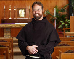 Conventual Franciscan Brother John Bamman, a native of Toledo, Ohio, poses for a picture in the chapel at St.&nbsp;Joseph Cupertino Friary in Prior Lake, Minn., where he is preparing for his ordination as a transitional deacon in 2009 and his ordination to the priesthood in 2010. He has assisted with youth retreats&nbsp;at Mount&nbsp;St.&nbsp;Francis Retreat Center in southern Indiana. (Photo by Dave Hrbacek/The Catholic Spirit) 