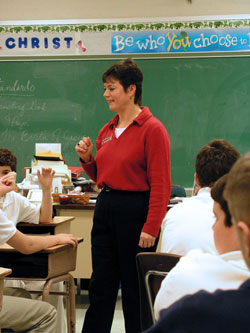 In this file photo from 2003, Laura&nbsp;Williams, who continues to teach middle school religion at St. Barnabas School in Indianapolis, interacts with students. St.&nbsp;Barnabas Parish runs its school on the stewardship model, not charging tuition to parishioners who enroll their children there. (File photo by Brandon A. Evans) 